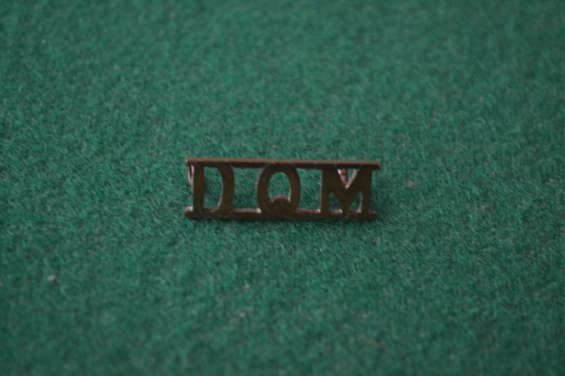 D.Q.M. Shoulder title